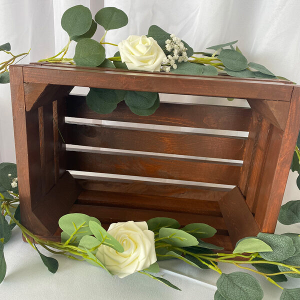 Wooden nesting crates with a rich, dark wood finish, perfect for displaying floral arrangements, wedding favors, or signage at a rustic wedding.