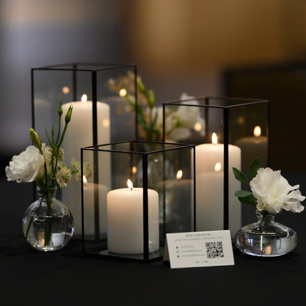 Elegant black frame hurricane vases rental in small, medium, and large sizes, ideal for wedding centerpieces, floral arrangements, or candle displays.