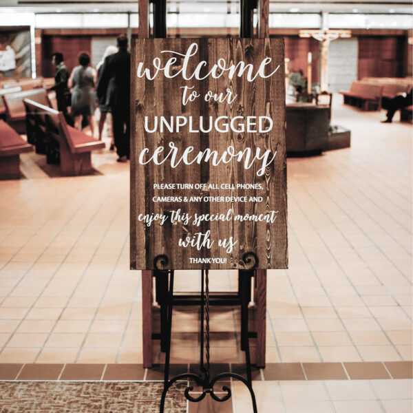 "Unplugged" Wooden Ceremony Sign with elegant script, natural wood finish, and rustic charm, displayed as a welcoming touch for weddings.